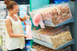 Woman buying dog food