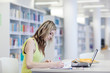 Photo: female student in the library female student in the library