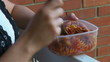 Woman eating at the balcony at lunch break - 1080HD