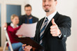 Foto: Couple in home with real estate broker Couple in home with real estate broker