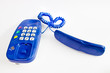 Isolated telephone with heart-shaped line