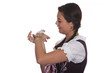 Frau in Tracht, mit Gerbil auf der Hand