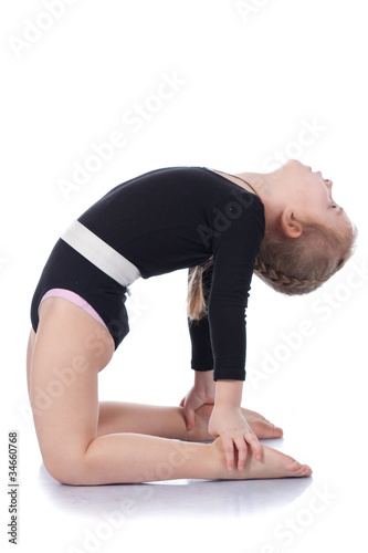 Photo: Girl child performing frog Girl child performing frog