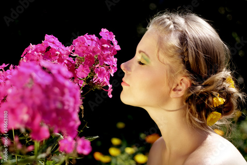 Photo: Girl and pink phlox flowers Girl and pink phlox flowers