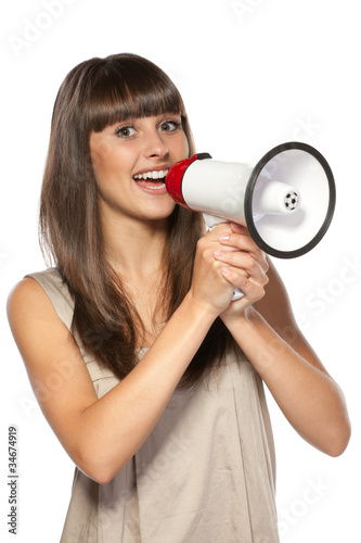 Photo: Portrait of beautiful female proclaiming into the loudspeaker Portrait of beautiful female proclaiming into the loudspeaker