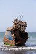 Old ship in the shallows near the shore Old ship in the shallows near the shore