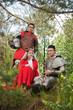 Two knights in armour and woman