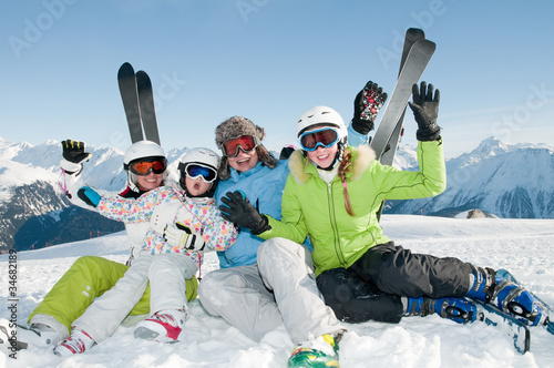 Photo: Ski, snow, sun and fun - happy family on ski Ski, snow, sun and fun - happy family on ski