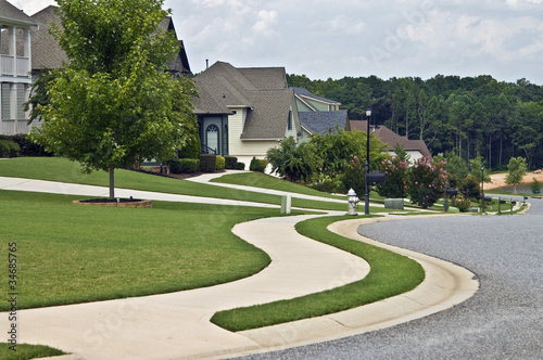 Photo: Sidewalk and Homes in Modern Neighborhood Sidewalk and Homes in Modern Neighborhood