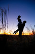 Couple on the sunset background.