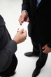 Detail businessman and woman exchanging cards