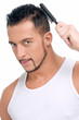 Foto: Man with perfect hair using comb brush Man with perfect hair using comb brush