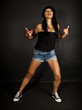 female hip hop dancer showing a shaka hand gesture