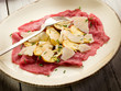 beef carpaccio with slice ovum mushroom and  parmesan flake