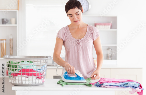 Photo: Woman ironing clothes Woman ironing clothes