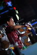 bartender making beveregae at nightclub bar
