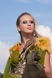 The woman in a beautiful old style dress with falcon The woman in a beautiful old style dress with falcon