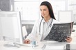 Smiling doctor working at desk