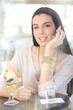 Happy woman sitting in cafe