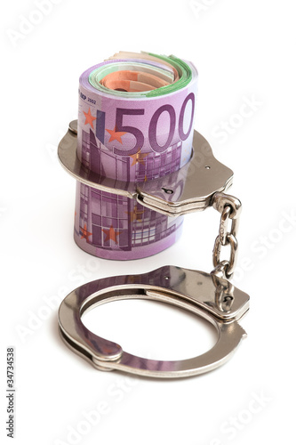Photo: Handschellen und Euro Banknoten Handschellen und Euro Banknoten