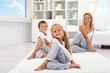 Kids and woman doing stretching exercises