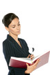 Young female reading book through the loupe