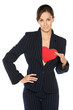Positive young business woman holding heart shape