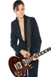 Young female in suit playing electric guitar