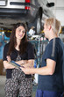 Female Customer in Mechanic Shop