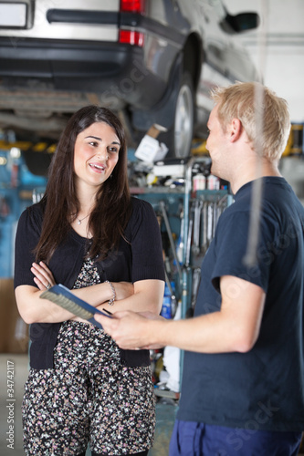 Photo: Female Customer in Mechanic Shop Female Customer in Mechanic Shop