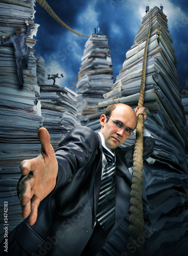 Photo: Businessman inviting you to climbing up Businessman inviting you to climbing up