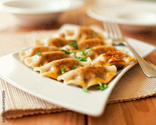 Photo: Pierogi on a plate.Polish cuisine Pierogi on a plate.Polish cuisine