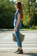 Photo: girl with a bag goes the way of pedestrian zebra girl with a bag goes the way of pedestrian zebra