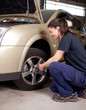 Woman Mechanic Tire Change