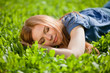 Photo: girl lying on the grass and sleeping peacefully girl lying on the grass and sleeping peacefully