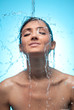 woman under splash of water woman under splash of water