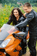 young couple with motorbike