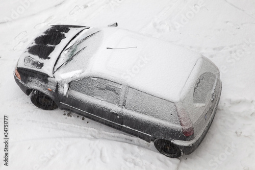 Photo: snow covered car after heavy snowstorm snow covered car after heavy snowstorm