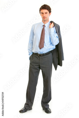 Photo: Full length portrait of confident businessman with jacket Full length portrait of confident businessman with jacket