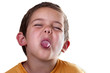 boy sticking out his tongue