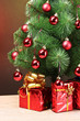 beautiful Christmas tree and gifts on wooden table beautiful Christmas tree and gifts on wooden table