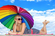 Photo: glamorous girl in retro style by color umbrella on the beach glamorous girl in retro style by color umbrella on the beach