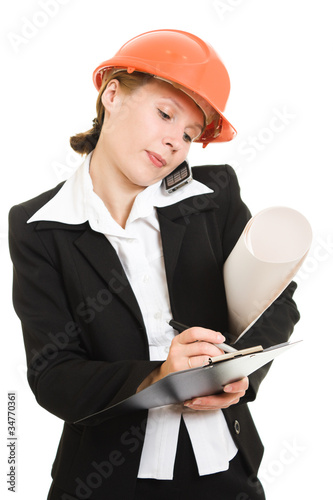 Photo: Businesswoman in a helmet on a white background. Businesswoman in a helmet on a white background.