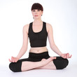 Photo: Yoga lotus pose padmasana by fit young woman Yoga lotus pose padmasana by fit young woman