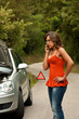 Photo: Broken Car - Young Woman Calls for Assistance Broken Car - Young Woman Calls for Assistance