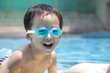 happy asian kid in swimming pool happy asian kid in swimming pool