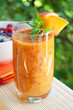 Peach cocktail in the garden in hot summer, sunny day