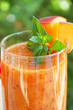 Peach cocktail in the garden in hot summer, sunny day