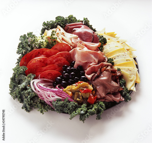 Photo: Antipasti garnished with kale, onions and tomatoes Antipasti garnished with kale, onions and tomatoes