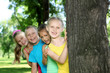 Foto: Children playing in the summer park Children playing in the summer park